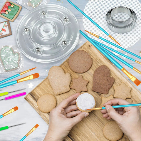123 Piece Cookie Decorating Kit With Large Acrylic Turntables Non Slip Silicone Mats Piping Bags And Detailed Decorating Brushes For Cakes Cupcakes in use with decorated cookies