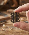 Old School Butterfly Hinges Set Smooth Rotation Space Saving 20 Pack Zinc Alloy Mini Hinges 90 Degree Fold held in hand