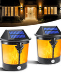 2 In 1 Solar Wall Lights Outdoor Pack Of 2 with Motion Sensor and Flickering Flame mode shown at night on building exterior