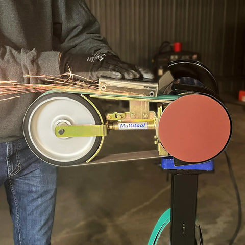 Heavy Duty 2X48 Belt Bench Grinder Attachment With 8 Inch Contact Wheel And 7 Inch Disc No Hassle Quick Change Auto Tensioning Setup Badass Knifemaking And Blade Sharpening Tool in use with sparks flying.
