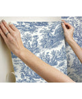 Applying Country Life Toile Peel And Stick Wallpaper Roll For Easy DIY Accent Wall Blue And White No Water Needed Quick Peel