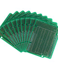 Set of Double Sided FR4 Prototyping Board 2.54mm Pitch 68.6x53.6mm Perfboard for DIY Nerds and Arduino Projects displayed fanned out.