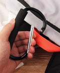4 Pack Large 5.5 Inch D Style Carabiner Hooks with Foam Cushioned Handles in hand showing easy bag attachment.