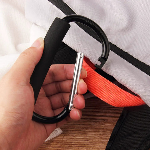 4 Pack Large 5.5 Inch D Style Carabiner Hooks with Foam Cushioned Handles in hand showing easy bag attachment.