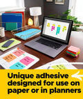 Kickass 3x3 Inch Pop Up Dispenser Notes 12 Pack on a desk with laptop, ideal for quick reminders and planning.