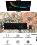 Ultra Large Floral Desk Mat For Gaming And Work 31.5 By 11.8 Inches With Stitched Edges An Extended Mouse Pad For Keyboard And Laptop Non Slip Rubber Base Dope Floral Office Decor For Women And Girls on desk with computer and phone.
