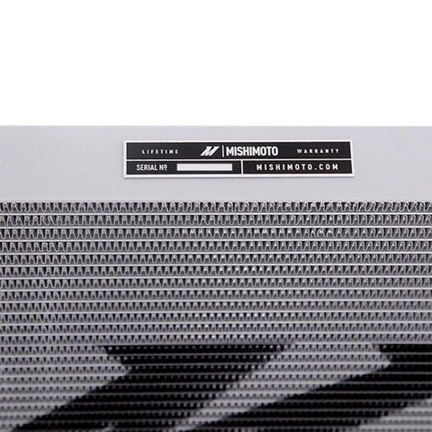 Close-up of Beefy Transmission Cooler for Ford Powerstroke 6.0L 2003 to 2007 with 37 row stacked plate core and warranty label.