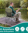 Man sitting on Foldable Camping Chair With Cup Holder, Non Slip Feet, Heavy Duty Portable Collapsible Lawn Chair for fishing