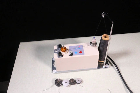 Portable Automatic Bobbin Winder for Sewing Machines With Thread Spool Pin And Guide Rods No Fuss Easy To Use Compatible With Juki Janome Brother Singer Quilting Embroidery Max Outside Diameter 1.1 Inches Hole 1/4 Inch Width 0.46 Inch 110V, close-up on tabletop