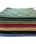 Heavy Duty 12 Pack Square Pot Holders Hella Heat Resistant Kitchen Hot Pads Quilted Cotton Padding Machine Washable Trivets For Baking And Tailgating 8X8 Inch stacked in various colors.
