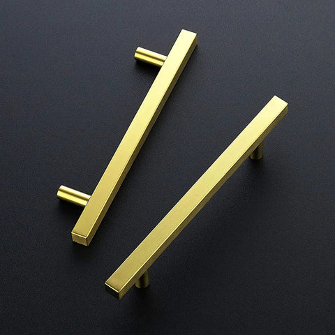 Gold Cabinet Pulls 30 Pack 5 Inch Modern Square Brushed Brass Drawer Handles For Kitchen Cabinets With Durable Brushed Brass Finish And Easy Install Upgrade Your Kitchen 7 3 8 Inch Overall Length. Two pulls on black surface, top view.