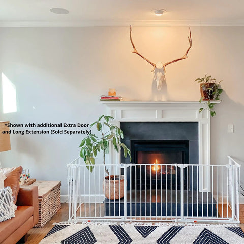 Extra Wide Walk Through Baby Gate, Customizable Safety Barrier fits from 35.4 to 82.7 inches, shown in front of fireplace, white.