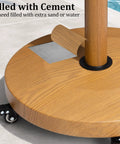 Teak Finish Patio Umbrella Base With Four Wheels, 44 Lb Round Heavy Duty Concrete Stand showing detail of cement fill and wood finish.