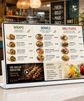 Premium Desktop Digital Menu Board With Smooth Plug And Play Usb Hdmi Link Vivid Multicolor Panel displaying food options on a cafe countertop.