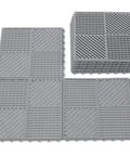 Stacked and laid out gray interlocking drainage floor tiles no slip with drain holes for pool bathroom shower patio boat and pet areas.
