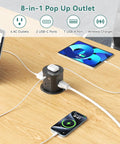 Pop Up Outlet With Wireless Charger And USB C Slick Retractable Recessed Power Station shown on desk charging devices