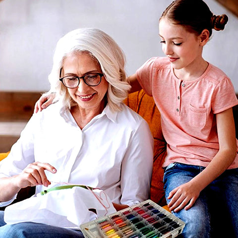 Grandmother and child using Dope Embroidery Floss Kit With Organizer Box, 200 Plus Colors 8m Mercerized Thread, crafting together