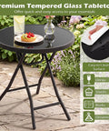 Compact Outdoor Folding Side Table With Tempered Glass Top And Heavy Duty Steel Frame For Backyard Hangouts, round table with snacks and drinks.