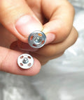 Close-up view of 120 Sets Sew On Snap Buttons Metal Fasteners For Clothing Repair And DIY Sewing 8mm 10mm 13mm Sizes Stainless Steel Rust Resistant.