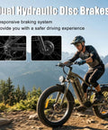 Rider with Beast 8000W Dual Motor Electric Mountain Bike for Adults With 60V 32Ah Battery, showing hydraulic disc brakes