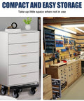 Heavy Duty Metal Air Compressor Cart With Dual Locking Caster Wheels Holds Eight Hundred Pounds in a garage for easy storage.