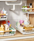 Super Sturdy Two Tier Under Sink Organizer With Adjustable C Shape Base And Smooth Pull Out Rollers Lets You Tame The Clutter And Save Serious Cabinet Space For Good filled with cleaning supplies and towels.