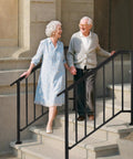 Heavy Duty Outdoor Hand Rails Kit For Two To Three Step Stairs, black iron railing supporting elderly couple on stairs.