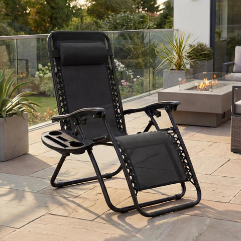 Set Of 2 Adjustable Zero Gravity Lounge Chairs With Steel Mesh, Pillows, And Cup Holder Trays, on a patio, Black.