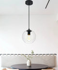 Industrial Farmhouse Globe Pendant Light Fixture With Adjustable Cord Black Hanging Ceiling Chandelier in kitchen setting