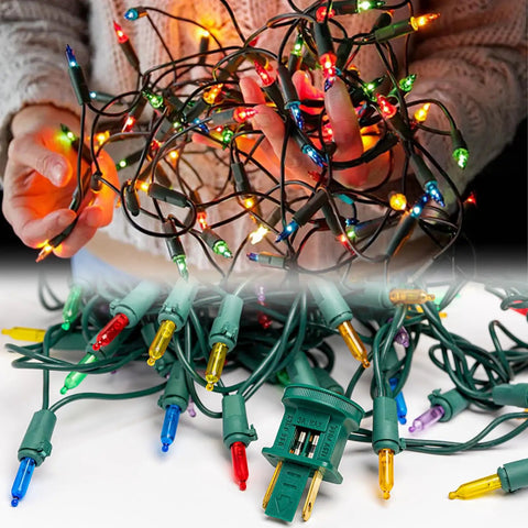 Person holding and displaying brightly lit colorful mini Christmas lights with a plug and connected wires.