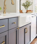 Kitchen cabinetry featuring Ville Champagne Bronze Cabinet Pull In Five And One Sixteenth Inch Center To Center, view of handle on drawer