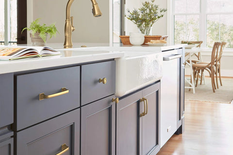 Kitchen cabinetry featuring Ville Champagne Bronze Cabinet Pull In Five And One Sixteenth Inch Center To Center, view of handle on drawer