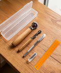 Top Tier 5 Piece Box Resizer Kit Featuring Scoring Wheel Perforator Precision Ruler Craft Knife And Tough Pp Storage Crate on wooden table.