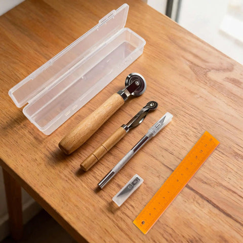 Top Tier 5 Piece Box Resizer Kit Featuring Scoring Wheel Perforator Precision Ruler Craft Knife And Tough Pp Storage Crate on wooden table.