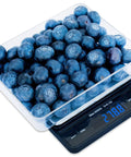 Pro Pocket Scale 3000g Digital Precision 0.1g 0.01oz Tiny But Mighty For Kitchen And Postal Use with blueberries on display