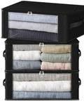 Three Pack Foldable Clothes Storage Bags With Large Clear Window And Sturdy Handles 35L Black For Closet Dorm Pillows Bedding Clothes And Blankets Great For Small Spaces, showcasing stacked storage bags with visible contents.