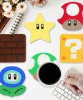 Punch Needle Coaster Kit For Easy DIY Embroidery 6 Piece All In One Set With Fun Patterns Tools Yarns Hoop Instructions And Coaster Holder For Beginners Kids And Adults showing six colorful video game-themed coasters on a table.