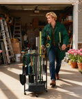 Person using Heavy Duty Rolling Garden Tool Organizer On Wheels With 14 Hooks And 5 Slots, 3 Tier Metal Cart Holds Rakes Shovels