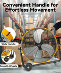 24 Inch Industrial Drum Fan With 8800 CFM High Velocity Air in warehouse, showing handle and wheels