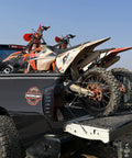Two motorcycles secured on a truck bed with Heavy Duty Ratchet Straps With Padded Handle 5280 Lb Break Strength One Point Six Inch Wide Tie Down Straps