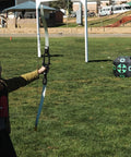 Child aiming at 15x15 All-Side Archery Target Block Portable Crossbow Practice Target With Carry Handle, on outdoor field