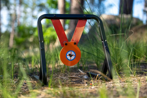 Mini Gong Steel Shooting Target For.22 Caliber With Stand in green grass