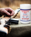 Lead Remover Wipes For Shooting 2 Pack 120 Wipes next to a rifle on a cloth surface