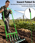Man using heavy duty broadfork for all soils with unbreakable build, five sharp cambered eleven inch tines in a garden setting