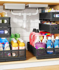 No Sweat Slick 3 Tier Under Sink Organizer Height Adjustable Metal Pull Out Cabinet Shelf With Smooth Glide Design For Zero Hassle Kitchen Pantry Bathroom And Laundry Storage 2 Pack Black showing bottles of cleaners organized under a sink.
