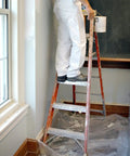 Painter on ladder with SuperTuff Plastic Drop Cloth For Big Paint Jobs 9 By 12 Feet covering floor to protect from paint spills.