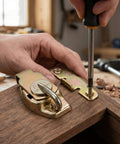Heavy Duty Table Leaf Connector With Swivel Latch Hardware For Dining And Extension Tables Built From Tough Steel being installed with a screwdriver.