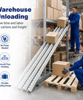 Heavy Duty Foldable Gravity Roller Conveyor For Warehouse Truck Unloading Portable Straight Line Material Handling System Moves Boxes With Ease No Electricity Needed, workers unloading boxes on conveyor.