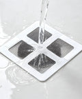 Hair Drain Stickers 100 Pcs Disposable Peel Stick on wet surface, catching hair with adhesive backing.