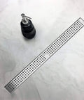 Top view of 36 Inch Linear Shower Drain With Brushed Nickel Finish, 304 stainless steel, and removable grate on a white surface
